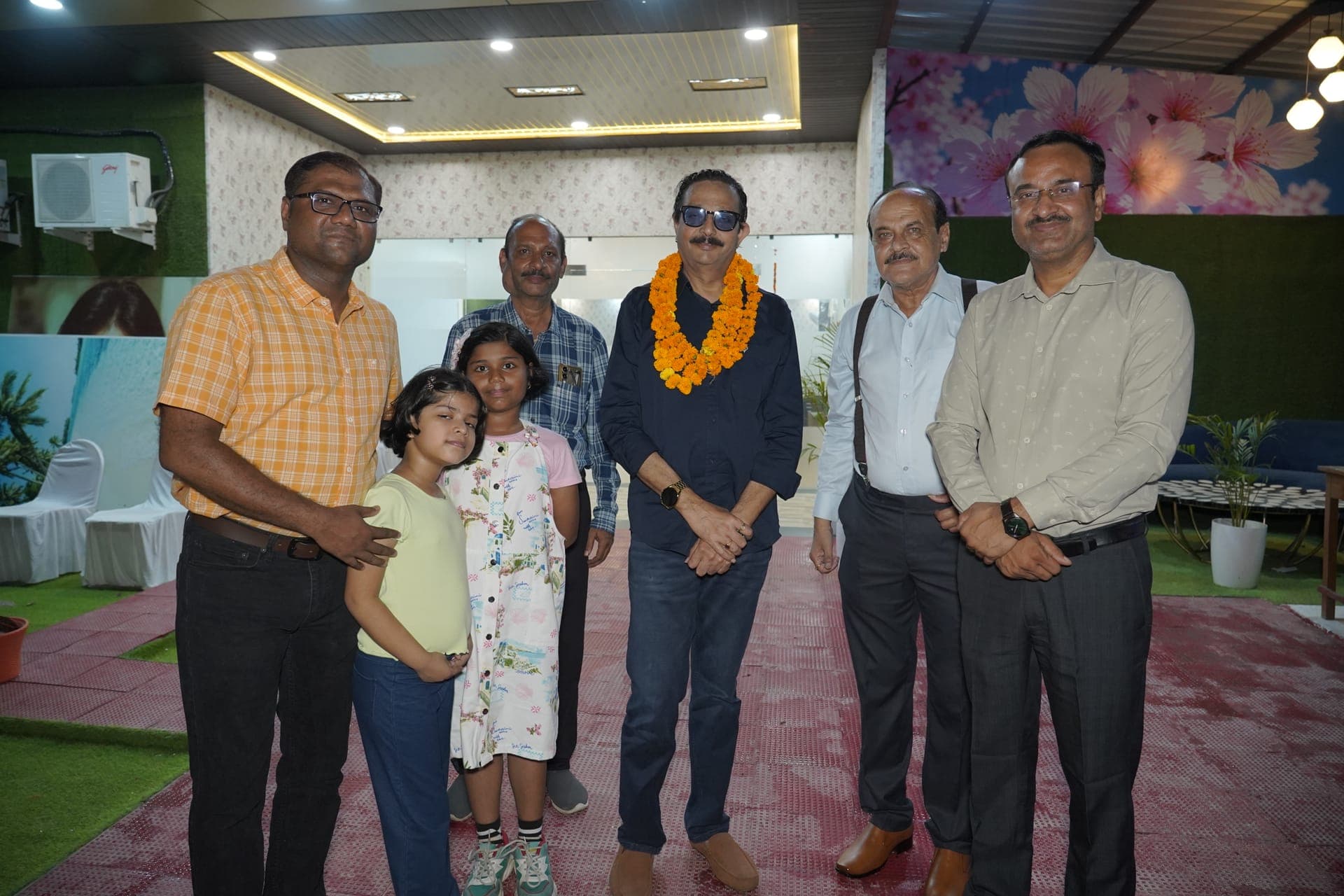 A welcome celebration with a marigold garland at the entrance