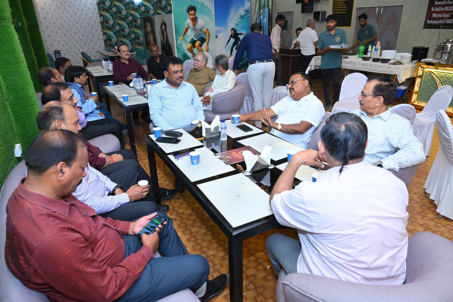 A group of guests seated and talking over dinner