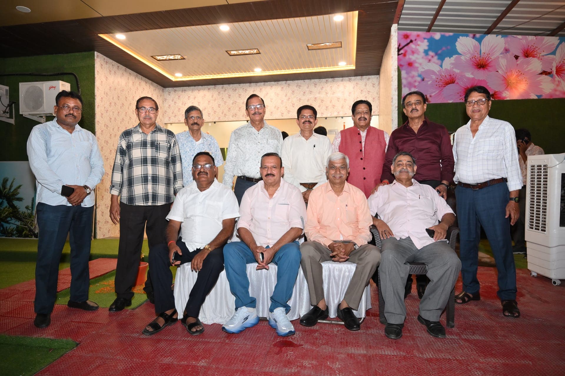A large group portrait at a celebration in the dining hall