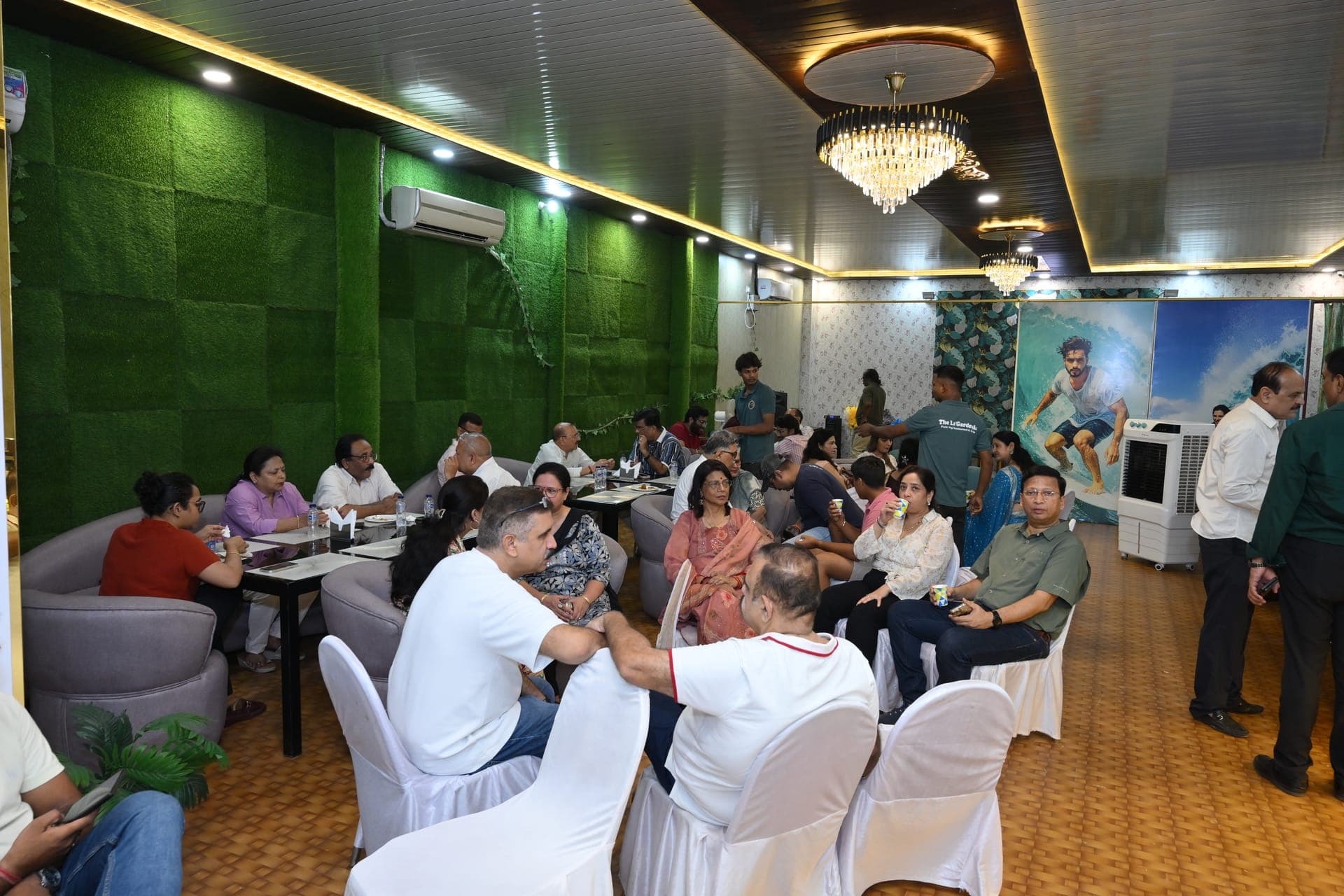 A full dining room with guests seated at tables and booths