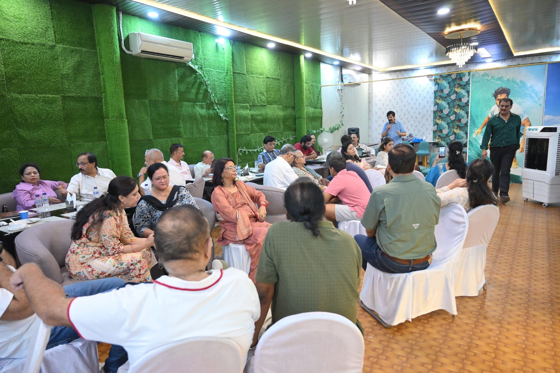 The banquet hall with its green living wall and crystal chandelier