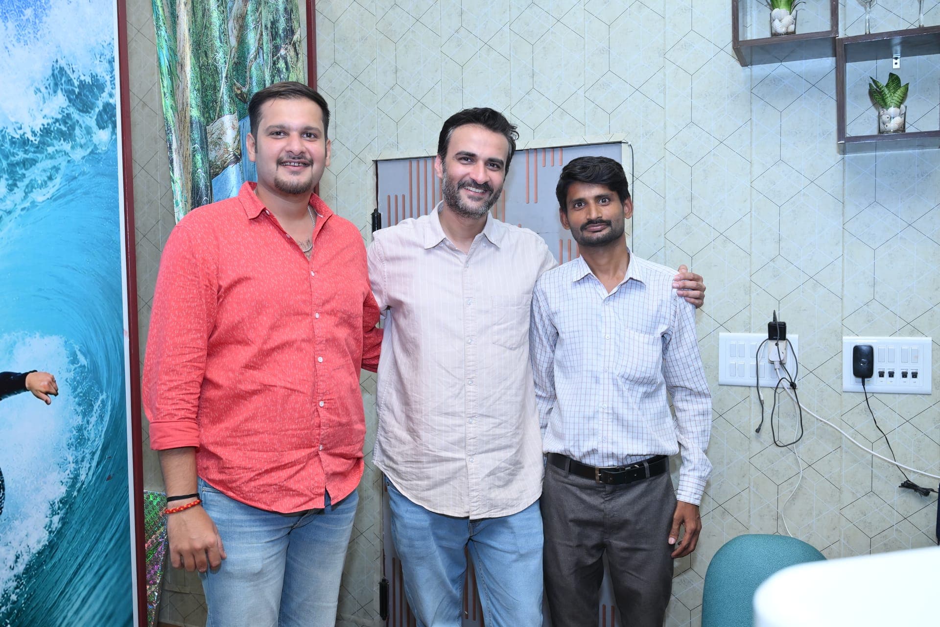 Three friends posing together inside the restaurant