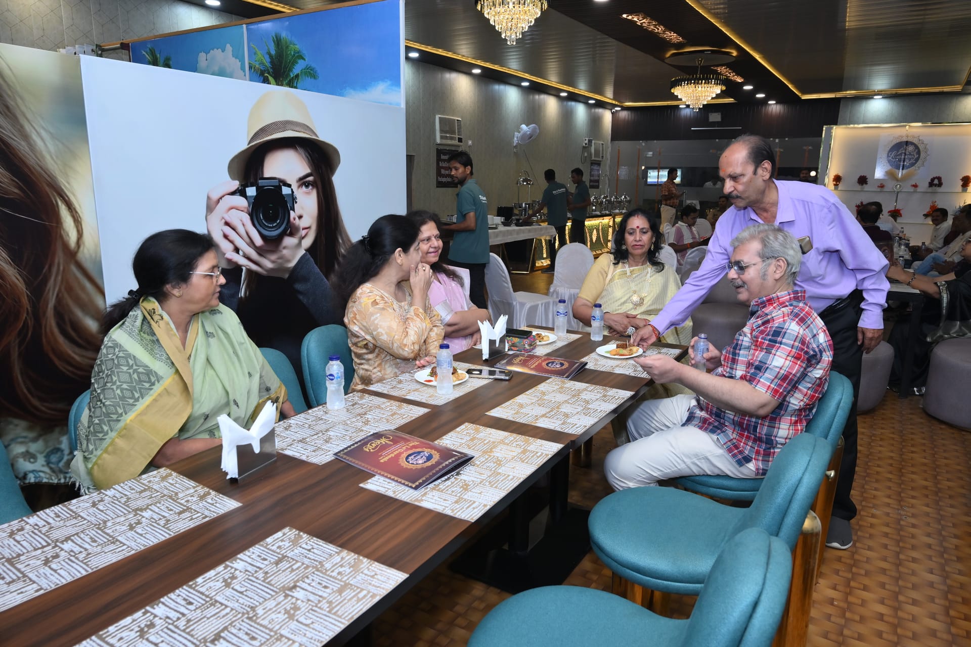 A family gathered around a long table for dinner