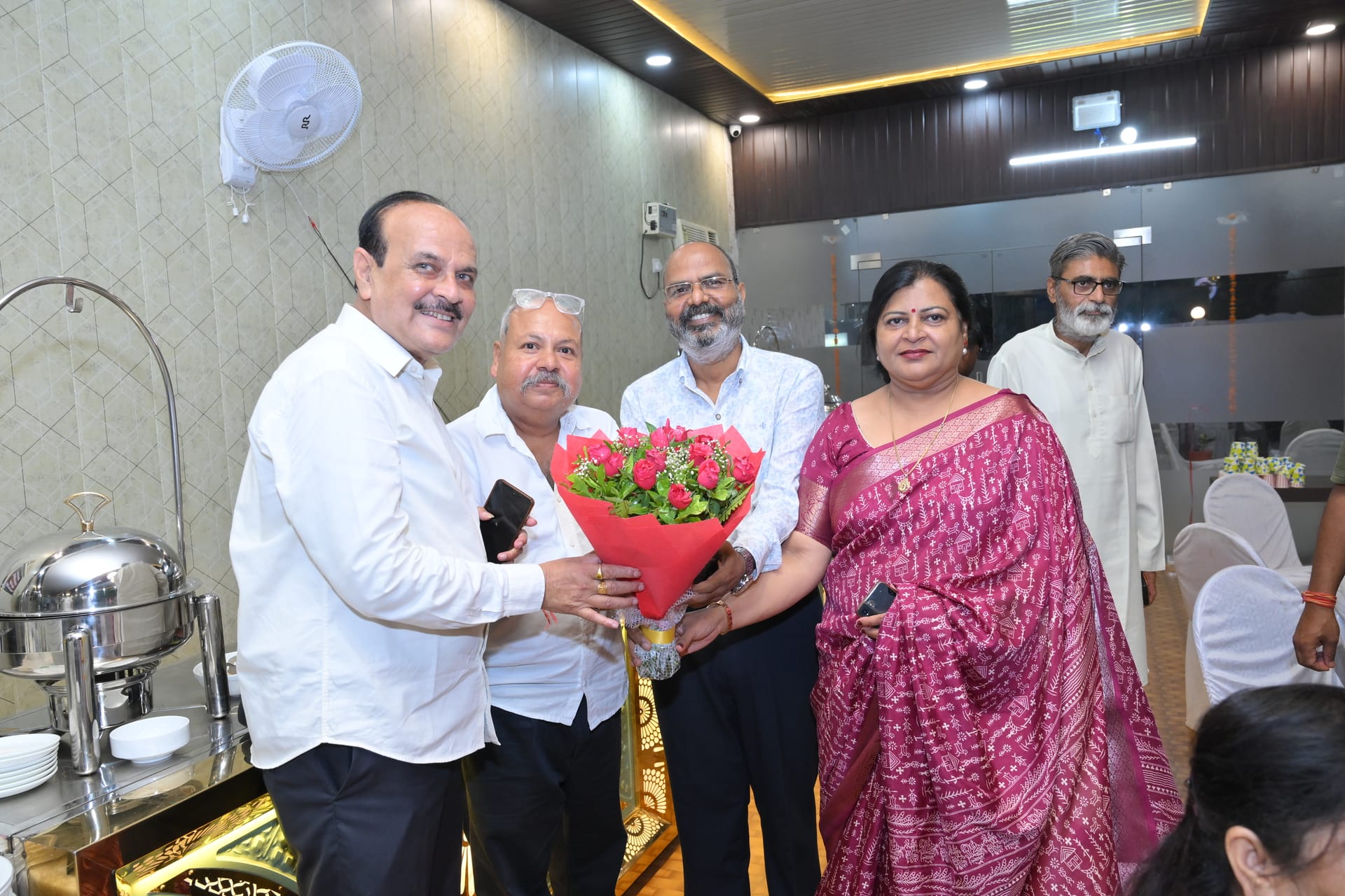 A bouquet of roses presented at a celebration
